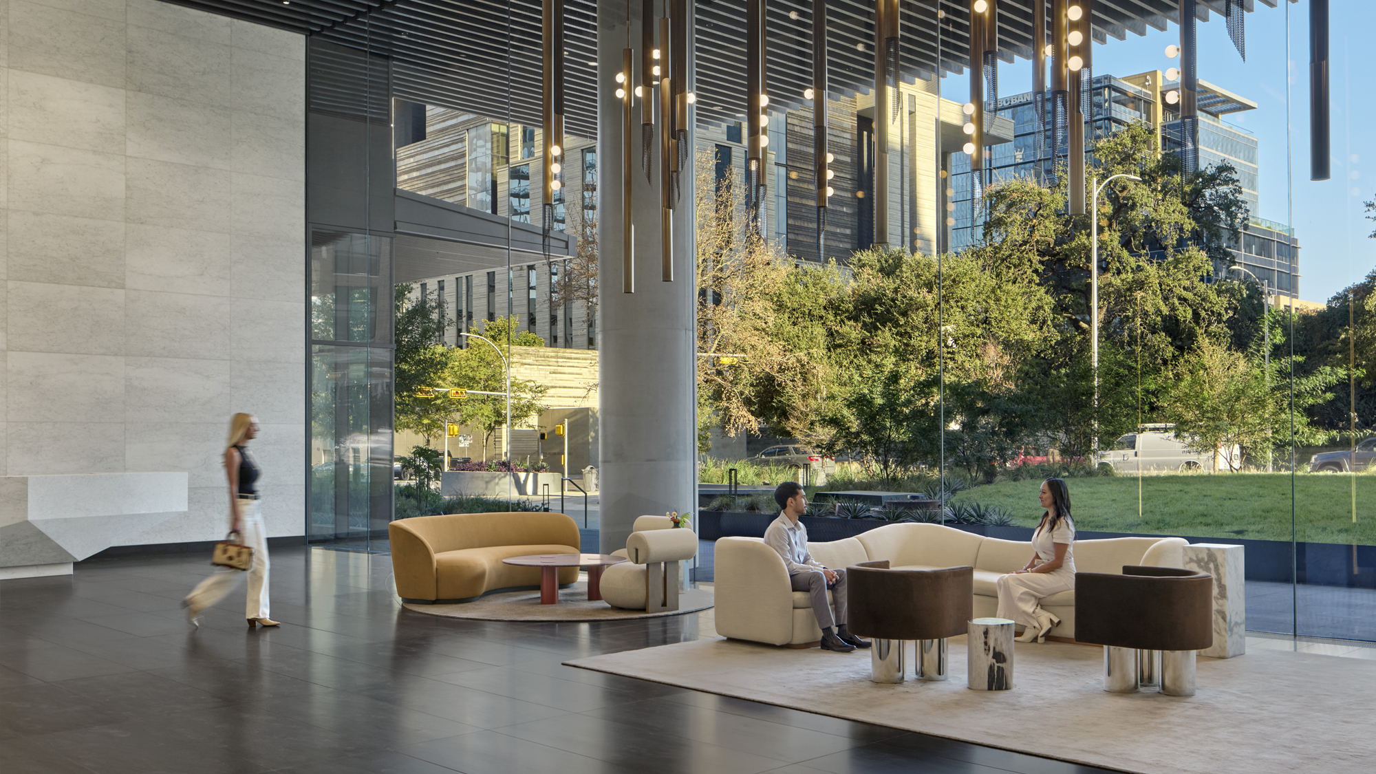 Tenants and guests utilize the 2-story lobby space with elevator banks