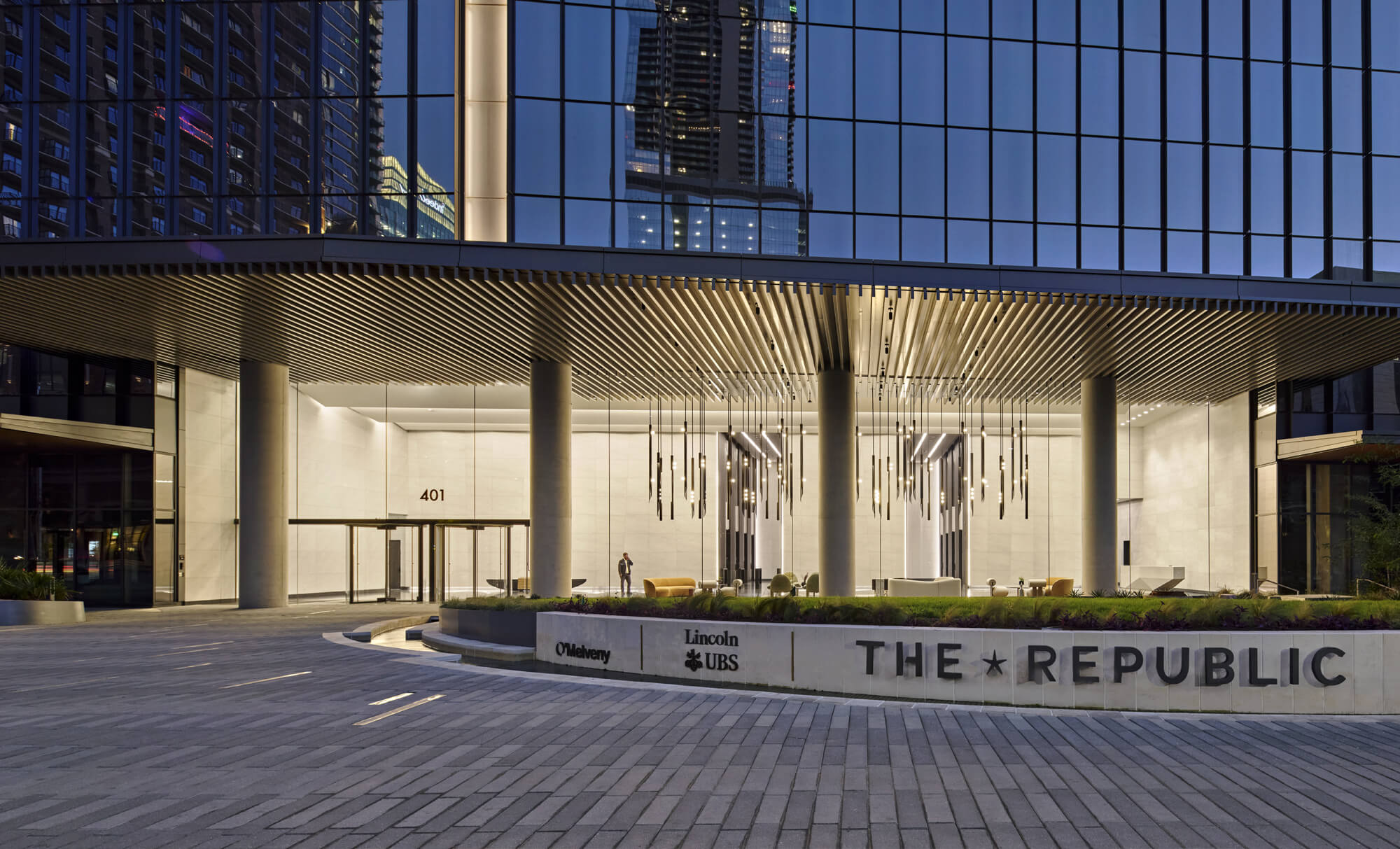 2-story seating and open office area with expansive city views