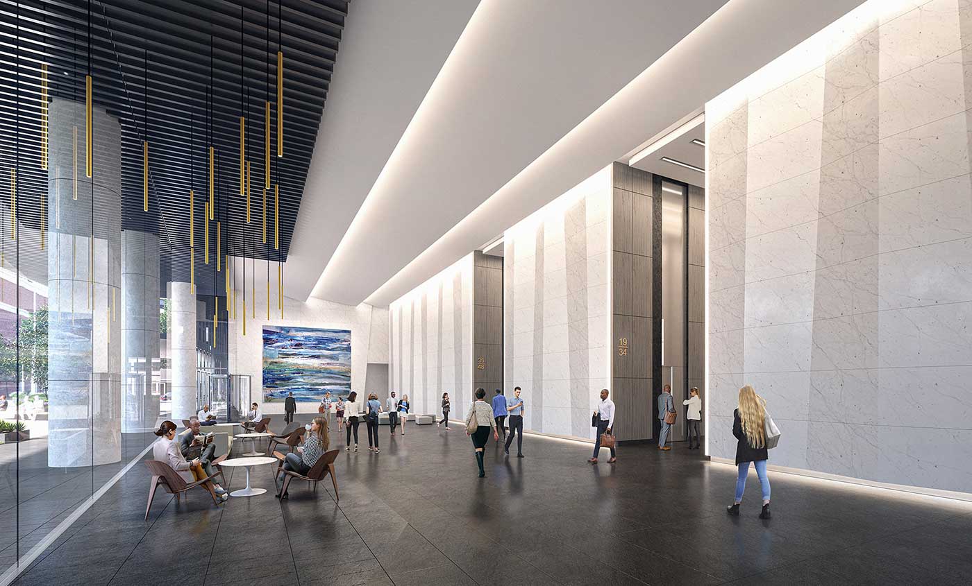 Tenants and guests utilize the 2-story lobby space with elevator banks
