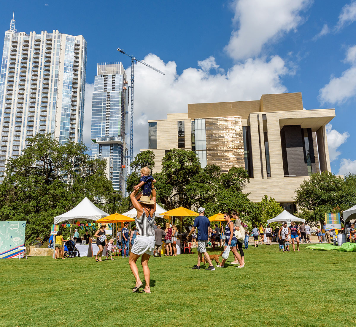 A crowd enjoys an outdoor event in downtown Austin